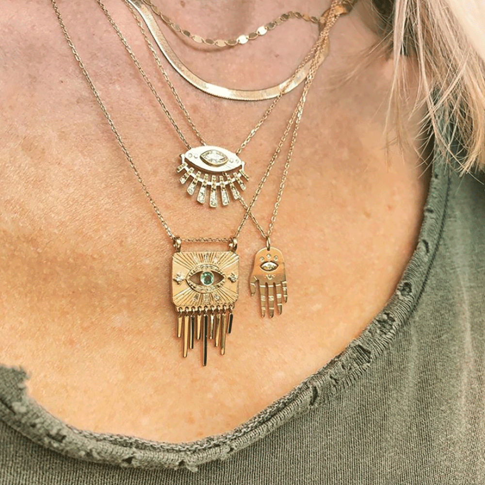 Celine Daoust 14k Sun Eye Diamond Necklace modeled on a woman's neck